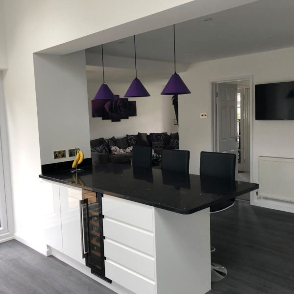 Modern White Kitchen with Black Work Surfaces