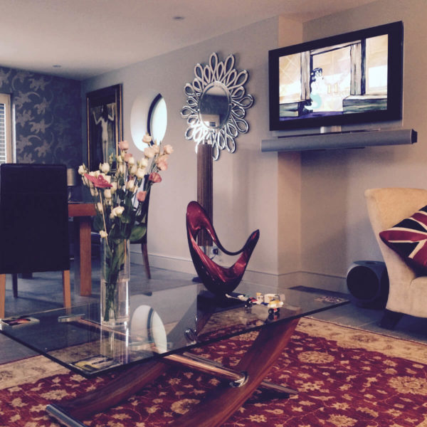 Living Room - Grey Walls, Red Rug, Wall Mounted TV