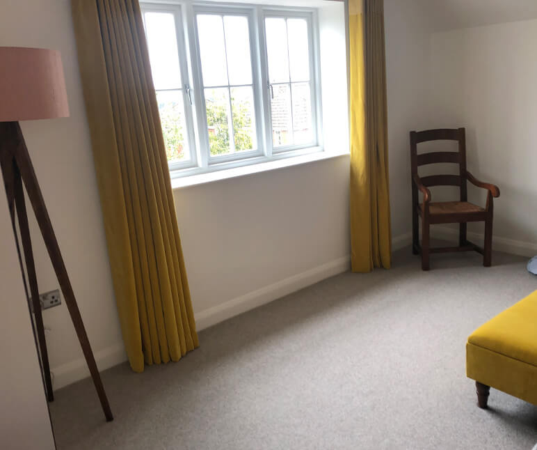 Freshly Painted Reception Room with Golden Yellow Curtains